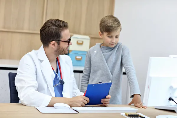 little-boy-in-clinic-having-a-checkup-with-pediatr-2026-01-07-06-01-15-utc-69b7ee7911222