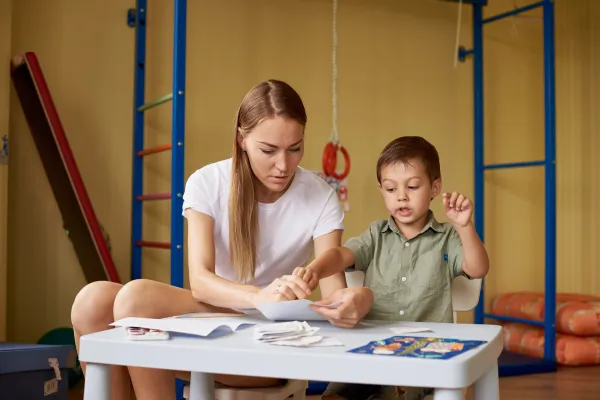 mother-and-son-draw-at-a-table-inside-the-room-2026-01-11-08-52-24-utc-69b7ee981f3fc