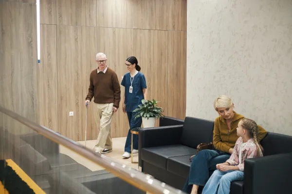 senior-man-walking-with-cane-while-nurse-assisting-2026-01-11-10-51-06-utc-69b7f2be8d473