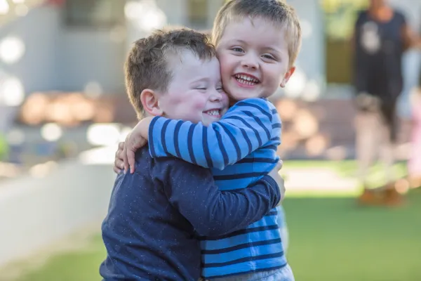 two-young-boys-outdoors-hugging-2026-01-09-09-36-55-utc-69b7eedf4305f